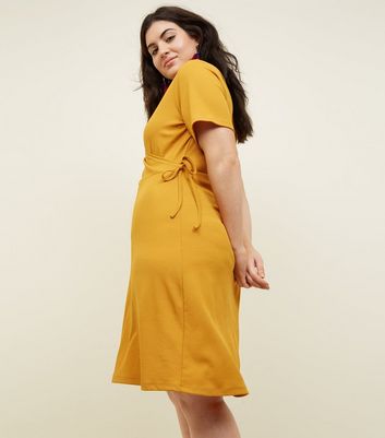 Curves Mustard Ribbed Jersey Wrap Dress | New Look
